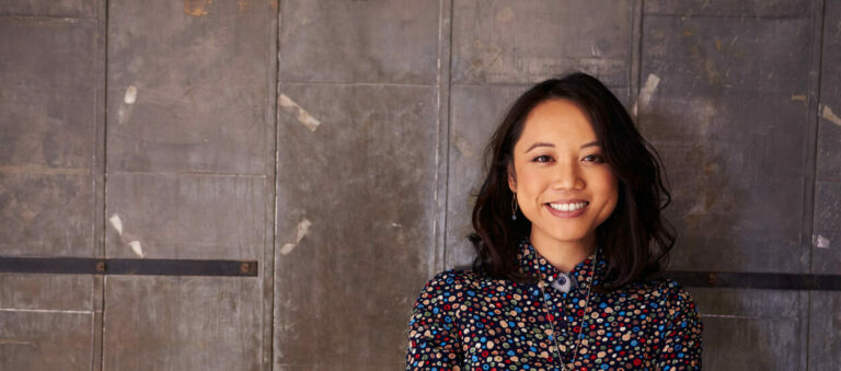 Portrait Of Female Designer Standing In Modern Office